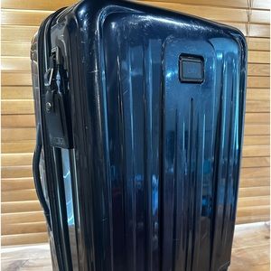 TUMI luggage V4 check in size. 28"H x 19"W x 11"D.